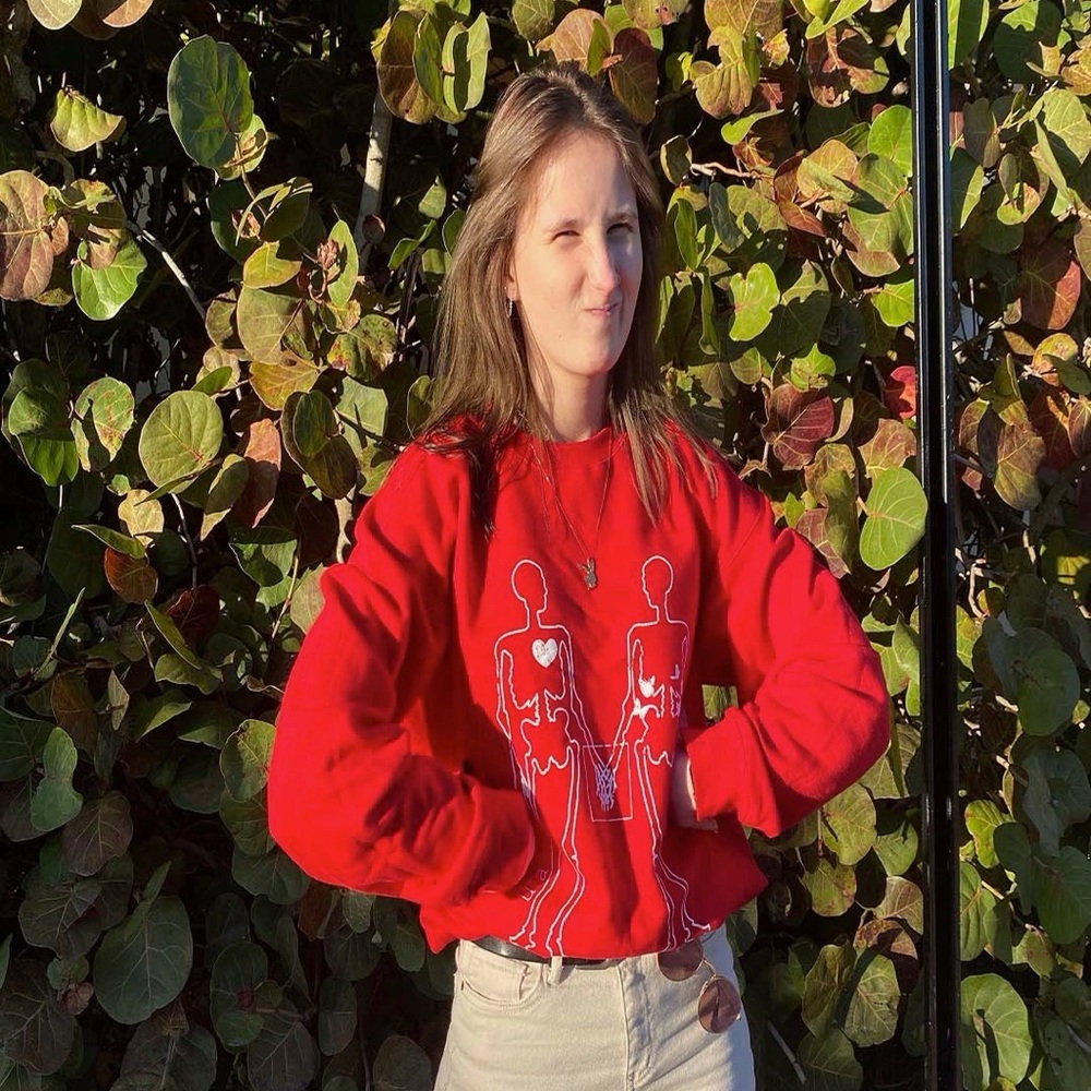 Red crew neck with skeletons design